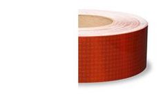 a roll of red tape on a white background