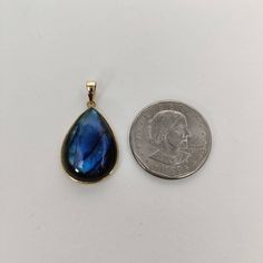 You can choose your own gem in my store. Let me know if you would like to see options Details of the pendants: Labradorite pendants Stone Weight: 17.85 carats Stone size and shape: 25×18 mm and Pear Metal: GOLD Purity: 14K (58.33%) approx Gold Weight: 0.80 grams Gross Weight: 4.37 grams Labradorite necklace pendant. These pendants are absolutely perfect for daily wear as they are light and definitely stylish This dainty pendant can be used in layers with other pendants. The initial price is for Blue Drop Jewelry With Cabochon, Blue Cabochon Drop Jewelry, Blue Drop Cabochon Jewelry, Number Jewelry, Handmade Jewelry Box, Labradorite Necklace, Dainty Pendant, Labradorite Necklaces, Bezel Pendant