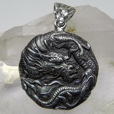 Hand Made DRAGON Pendant Sterling silver 15.5 grams 34x47mm Made in the USA Silver Dragon Design Round Pendant Jewelry, Silver Jewelry With Dragon Design Round Pendant, Collectible Silver Necklace With Dragon Design, Silver Dragon Design Collectible Jewelry, Traditional Silver Jewelry With Dragon Design, Dragon Medallion, Silver Dragon, Dragon Pendant, Made In The Usa