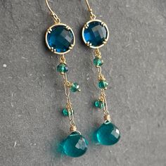 Turquoise Faceted Drop Earrings, Blue Briolette Jewelry For Party, Gold Dangle Crystal Earrings With Gemstone Accents, Turquoise Drop Jewelry For Party, Blue 14k Gold-filled Dangle Jewelry, Blue Faceted Long Drop Jewelry, Blue Faceted Drop Jewelry, Teal Crystals, Blue Dangle Earrings