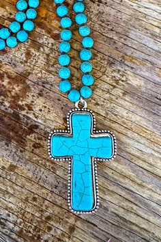 Stones May Vary By Color Crystal Glass Beads Imported Length: 34" Pendant: 2.5 Bohemian Turquoise Cross Jewelry, Adjustable Turquoise Cross Jewelry, Bohemian Blue Cross Jewelry, Bohemian Turquoise Cross Necklace, Bohemian Beaded Cross Necklace, Bohemian Cross-shaped Beaded Necklaces, Handmade Turquoise Cross Necklace, Bohemian Turquoise Howlite Beaded Necklace, Adjustable Blue Howlite Necklaces