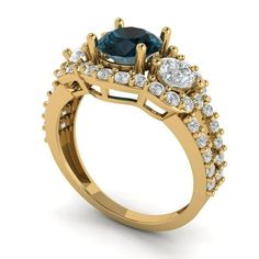 a gold ring with an oval blue diamond surrounded by smaller round diamonds on the side