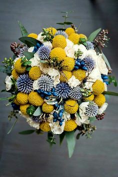 a bridal bouquet with blue and white flowers