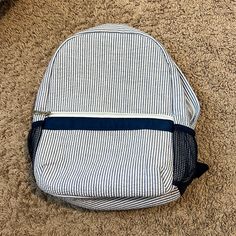 Navy Blue & White Striped Toddler Backpack. Front Zipper Pocket. Mesh Pockets On Each Side. Double Zippered Main Compartment With Big Pocket On Inside. Inside Material Is Easily Wiped Down. Barely Used, Like Brand New!! Back To School White Backpack, Casual Blue Bags, Preppy Blue Backpack For Back To School, Casual Backpack For End Of School Year, Blue Summer School Backpack, Blue Standard Backpack With Removable Pouch, Blue Educational Backpack, Blue Backpack With Adjustable Strap For On-the-go, Multicolor On-the-go Backpack With Adjustable Strap