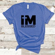 "The \"I'm Blessed\" T-shirt is a simple yet powerful garment that serves as a reminder and declaration of gratitude and appreciation. It features the phrase \"I'm Blessed\" prominently, conveying a sense of thankfulness for the abundance of blessings in one's life. This T-shirt celebrates the positive aspects of life and encourages an attitude of gratitude, reminding wearers to recognize and cherish the blessings they have been bestowed with. It serves as a positive and uplifting expression of faith, contentment, and a reminder to count one's blessings daily. This classic unisex jersey short sleeve tee fits like a well-loved favorite. Soft cotton and quality print make users fall in love with it over and over again.  .: 100% Airlume combed and ringspun cotton (fiber content may vary for d Im Blessed, An Attitude Of Gratitude, Positive Aspects, Cross Shirt, Cross Shirts, Attitude Of Gratitude, One Life, Jersey Shorts, Print Making