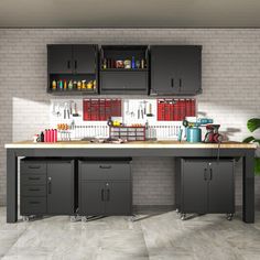 a workbench with cabinets and tools on it in front of a brick wall