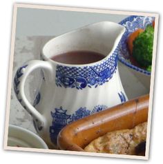 there is a hot dog next to a bowl of broccoli and other food