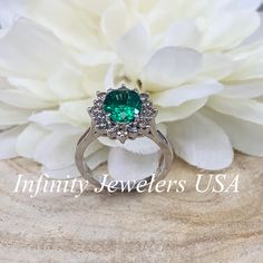 Emerald Halo Ring 14k White Gold, Vintage Emerald Engagement Ring, Oval Halo Ring With Emerald, May Birthstone Ring, Emerald Jewelry #6719 We feature the finest quality lab grown emeralds in the world. The properties of lab-grown are physically, chemically and visually identical to natural, just grown in a lab setting. Emerald is the birthstone of May -Approximate total carat weight: 2.50ctw diamond equivalent -Center Stone Size: 9x7mm approx. 2.10ct. diamond equivalent -Center Stone Shape: oval Emerald Cluster Ring With Halo Design, Halo Diamond Ring For May Birthstone, Gia Certified Oval Diamond Ring For Anniversary, Halo Design Diamond Ring For May Birthstone, Green Center Stone Ring In 14k White Gold, Green 14k White Gold Ring With Center Stone, May Birthstone Gemstone Halo Ring For Anniversary, Halo Ring With Center Stone For May Birthstone, Halo Ring With Prong Setting For Anniversary