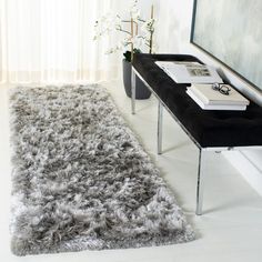 a long rug is on the floor next to a table