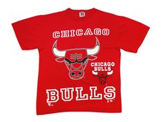 "Vintage Chicago Bulls shirt, undated from the 90s. Single-sided design printed on 100% cotton Brand: Team Rated Tag Size: L Measurements: Pit to pit -- 23\" / Length -- 28.5\" Condition: 7/10 -- in good shape overall with minor cracking to graphics, some small stains on the torso, lower back, and upper back, and a pinhole above the back bottom hem. See last 5 pics for details" 90s Logo Print Sports Top, 90s Style Sports Event Logo Print Tops, 90s Logo Print Tops For Sports Events, Vintage Team Logo Tops For Streetwear, Vintage Streetwear Tops With Team Logo, Vintage Tops With Team Logo For Streetwear, Vintage Team Logo T-shirt For Streetwear, Vintage Streetwear T-shirt With Team Logo, 90s Graphic Print T-shirt For Fan Gear