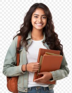 a girl holding a folder and smiling at the camera with her hands in her pockets