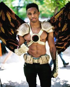 a man with large wings on his chest