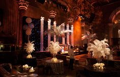 a room filled with tables and chairs covered in white feathers