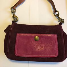 This Has Barely Been Used! It Looks Brand New Even Though It Is Now Vintage! Deep Plum Suede Is The Outside Color With A Pretty Purple/Pink Leather Pouch Pocket. The Inside Is A Beautiful Purple/Pink Silk. There Is A Zipper Pocket On The Inside And A Large Open Pocket. The Hardware Is Aged Looking Gold/Bronze. The Top Handle Has 2 Strips Of Dark Leather Which Shows No Signs Of Wear. This Bag Comes Complete With A Dust Bag And A Suede Brush/Cleaner Also Never Been Used And Provided By Coach. Pink Suede Bag, Purple Leather Shoulder Bag With Adjustable Strap, Purple Leather Clutch Bag, Purple Rectangular Shoulder Bag With Gold-tone Hardware, Everyday Purple Pouch Shoulder Bag, Purple Everyday Pouch Shoulder Bag, Purple Clutch Bag For Everyday Use, Rectangular Purple Coach Shoulder Bag, Purple Leather Bags With Removable Pouch