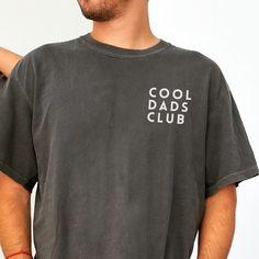 Cool Dads Club Cool Dads Club Shirt, Funny Husband Shirt, Gift for Him, Fathers Day Gift, Daddy Shirt, Dad to be,  New Dad, Funny Dad Joke, Pun Shirt Comfort Colors®  is a 100% cotton pre-shrunk tee that stands out in fit, color and quality. These popular shirts have a distinctive vintage color wash to them, which is eco-friendly and holds up to repeated use- making this your go to tee! DETAILS -100% ring-spun cotton for a softer feel -Pre-Shrunk  -Relaxed, medium weight unisex fit- TRUE TO SIZE Casual Crew Neck Tops For Father's Day, Father's Day Relaxed Fit Text Print Tops, Casual Black Top For Father's Day, Father's Day Text Print Relaxed Fit Tops, Casual Top With Text Print For Father's Day, Casual Cotton Tops For Father's Day, Casual Short Sleeve Tops For Father's Day, Father's Day Casual Slogan Tops, Casual Screen Print Shirt For Father's Day