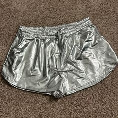 Silver Shorts Size Large, Never Worn. Perfect For Casual Wear Or For A Costume! Silver Stretch Bottoms For Summer, Casual Shiny Metallic Bottoms, Silver Short Bottoms For Night Out, Metallic Shimmer Bottoms For Summer, Metallic Shimmer Summer Bottoms, Casual Metallic Shorts, Casual Metallic Finish Shorts For Night Out, Casual Metallic Shorts For Night Out, Casual Silver Bottoms For Night Out