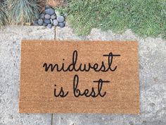 a door mat with the words midwivest is best written in black on it