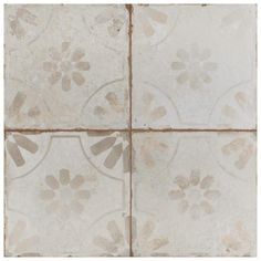 the tile is white with brown flowers on it