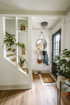 the entryway is clean and ready to be used as a place for hanging plants