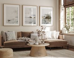 a living room filled with furniture and pictures hanging on the wall above a coffee table