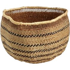 a woven basket with black and white stripes on the bottom, sitting in front of a white background