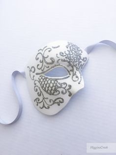 You can wear this Phantom of the Opera Musical inspired mask with comfort for long hours. Perfect for Masquerade balls, Wedding and Proms! You can pick custom color option if you would like a customized mask in a different color to match your attire/theme S H I P P I N G - Processed same day or within 24 hours. 1-2 day guaranteed delivery services offered, add items to cart and click on shipping tab for rates. Pls leave a check out note with your need date & contact number (especially for ex Full Face Silver Masquerade Mask, Silver Full Face Masquerade Mask, Silver Full Face Mask For Masquerade, White Full Face Mask For Masquerade, White Adjustable Masks And Prosthetics For Masquerade, Adjustable White Masks And Prosthetics For Masquerade, White Mardi Gras Masquerade Masks, Elegant White Eye Mask, White Eye Mask For Masquerade