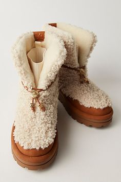 Taking cozy to a whole new level, this pair of booties from Sam Edelman is featured in a foldover style with fuzzy panels, a stretchy in-sock, and a chunky lugged sole. **Features:** Ankle length, foldover style, round toe, stretchy sock lining, faux sherpa panels, faux suede trim, chunky lugged platform outsole **Why We | Olin Cozy Boots by Sam Edelman at Free People in Natural/Harvest Brown, Size: US 8 Cold Weather Boots Women, Sock Boots Outfit, Cute Winter Boots, Rich Girl Fashion, Winter Boots For Women, Fuzzy Boots, Winter Shopping, Cozy Boots, Brown Fits