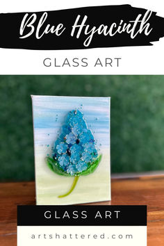 blue hyacinth glass art is displayed on a table with text overlay