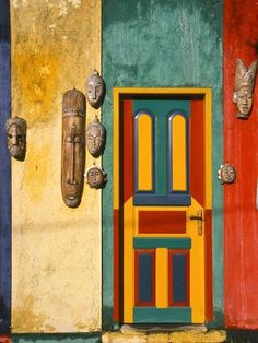 an image of a colorful door with two faces on it