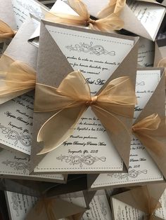 the wedding stationery is made up of cards with bows and ribbons on top of each card