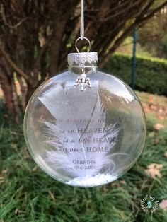 a glass ornament hanging from a tree