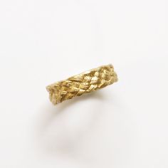 Inspired by the flaxen braids in many of Sandro Botticelli's paintings, this wide braided ring began with a 5-strand braid of acrylic hair that was molded and cast in 14k gold to capture the texture and shape of a real plait of hair wrapped around the finger. Perfect for solo wear or in addition to any ring stack. Measures approx. 6mm wide and 1mm thick. Matte Gold Finish This ring is made to order, to your size, please allow 6 weeks for delivery. Every piece of Palm Sunday Primavera jewelry com Sandro Botticelli Paintings, Braided Jewelry, Botticelli Paintings, Five Strand Braids, 5 Strand Braids, Braid Jewelry, Rope Rings, Strand Braid, Braided Ring