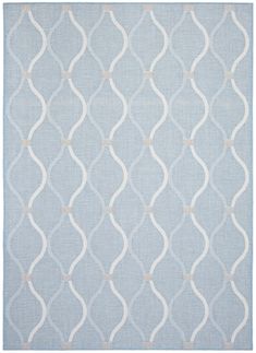 a blue and white rug with wavy lines on it