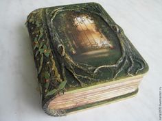 an old book is covered in vines and ivys, with a door to the outside