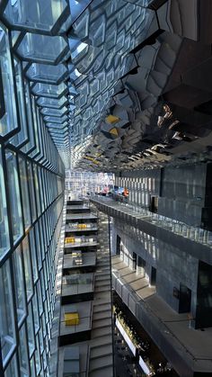 the inside of an office building with many windows and balconies on each floor