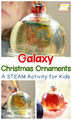 a child holding a glass christmas ornament with the words galaxy on it and an image