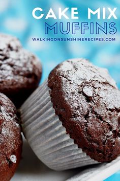 three chocolate muffins sitting on top of a white plate with the words cake mix muffins above them