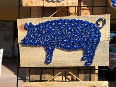 a pig made out of blue glass beads