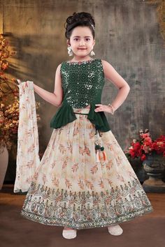 ABOUT THIS ITEM Fabric Details: This is an exclusive Bollywood style party wear featuring excellent craftsmanship, beautiful embroidery, traditional prints, and vibrant colors. The Lehenga choli set is made with light weight ,  soft georgette material that is skin-friendly and comfortable to wear for kids. Age Group: 2-8yrs. For best fitting, please take measurements for your child and refer to the size chart in the last picture before purchase. Wash care Instructions: Do not bleach, Iron at low heat, and Dry Clean ( preferred for first wash). Occasion: Birthday gift, Festive wear, party/casual wear, wedding, and all special occasions. Package Includes: 1 Lehenga +1 Blouse + 1 duppatta.  ( sleeves can be attached if needed )  The Lehenga has beautiful traditional prints, multiple layers of White Resham Embroidery Dupatta, Festive White Party Skirt, White Choli For Festive Occasion Of Eid, White Choli For Festive Eid Occasions, Festive White Choli For Eid, Traditional White Embroidered Skirt, Festive Fitted White Skirt, White Fitted Skirt For Festive Occasions, White Embroidered Choli For Eid