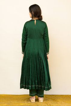 Green silk chanderi anarkali with zardosi hand embroidered neckline, yoke and cuffs. Comes with pant and a kota tissue dupatta.
Components: 3
Pattern: Hand embroidered
Type Of Work: Zardosi
Neckline: Round
Sleeve Type: Full
Fabric: Silk chanderi, Dupatta : Kota tissue, Lining : Mulmul
Color: Green
Other Details: 
Embroidered dupatta
Closure : Back button
Disclaimer : The natural imperfection and textures in the weaves are the outcome of handloom fabrics (not to be considered as defect)
Occasion: Tissue Dupatta, Chanderi Anarkali, Chanderi Dupatta, Embroidered Anarkali, Handloom Fabric, Embroidered Dupatta, Embroidered Neckline, Fashion App, Fabric Silk