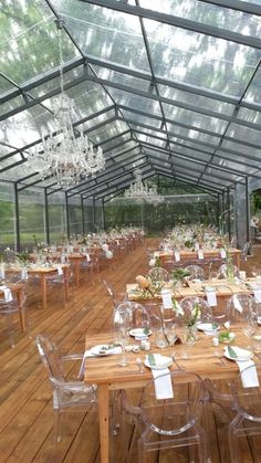 an indoor dining area with clear chairs and tables