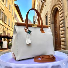 This bag has been made of the best genuine leather by local master crafters of Florence in Italy, designed for women who only accept premium Italian quality and luxury leather bags and modern Italian fashion. . Size: Height: 28 cm/11.02 inches. Width: 33 cm/12.99 inches. Depth: 15 cm/ 5.91 inches. Color: Cream- Brown . The story of this bag:  In the heart of Italy, where artistry and craftsmanship have flourished for centuries, a group of skilled artisans pours their passion into creating exquis Leather Bags For Women, Handmade Leather Tote Bag, Handmade Leather Bags, Luxury Leather Bag, Bag Lock, Leather Store, Italian Leather Bags, Purse Gift, Brown Bag