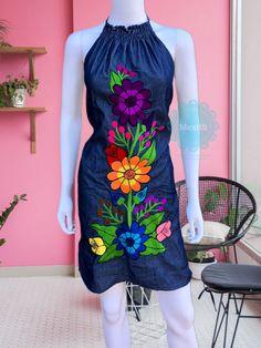 "Floral Embroidered Mexican Halter dress. Made out a lightweight denim. Please note: each dress is unique, the embroidery may be slightly different from the one pictured. Size- Medium Dimensions: Bust- 41\" Hips- 42\" Length- 34\" 🧵Made in Chiapas, Mexico. 🧺Care Instructions: We recommend hand washing, air dry. 📲Please feel free to message me with any questions regarding sizing and fit. 📷Additional photos can be provided upon request. 👗Always allow a little room and consider your own measur Blue Embroidered Bohemian Denim Dress, Blue Bohemian Embroidered Denim Dress, Embroidered Fitted Denim Dress, Bohemian Embroidered Denim Dress, Bohemian Denim Dress With Floral Embroidery For Spring, Floral Embroidered Fitted Denim Dress, Embroidered Denim Dress For Summer, Spring Embroidered Denim Blue Dress, Fitted Floral Embroidery Denim Dress