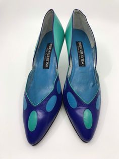 "An unworn pair of Mario Valentino heels from 1980s.  The front is bright blue with light blue and sea green oval shapes. The back and heel are sea green. They are lined with suede and silver leather with a blue leather inner sole.  Size EU 7.5B Heel height 3\"/8 cm These are in very good condition with some light mottling on the sea green leather at the back as photographed. The heel tips are chipped." Mint High Heels, Ralph Lauren Travel Bag, 80s Shoes, Valentino Heels, Canvas Duffel Bag, Heart Shoes, Ralph Lauren Leather, Green Heels, Green Oval