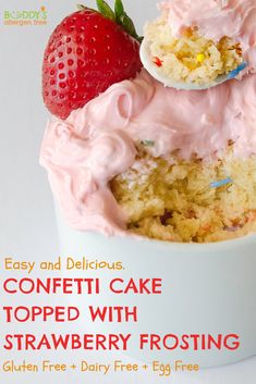 a close up of a cupcake with frosting and strawberries on top in a bowl