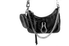 Chain of Command Black Leather Mini Convertible Bag With Detachable Airpod Case Serving bold features in a compact form, we took a 90s inspired silhouette and updated for today's tech essentials. Sturdy hardware, including a versatile chain strap that gives both decor and utility, this mini yet mighty new drop includes a comfortable wide band adjustable strap for wearing on your waist or shoulder, a detachable Airpod case and an industrial metal clip that allows both style and utility. When your Functional Shoulder Bag With Silver-tone Hardware, Functional Shoulder Bag With Silver-tone Hardware For Everyday Use, Modern Black Bags With Hardware, Mini Cabrio, Leather Utility Belt, Tech Essentials, Holster Bag, Chain Of Command, Mini Convertible