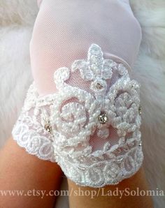 Ivory Bridal gloves, Lace Wedding gloves, Ivory lace gloves, Gloves with lace White bridal gloves, Short wedding gloves, Gloves for wedding This is a beautiful Wedding gloves with beaded. If you have any questions please send me a message, I will be happy to help. READY TO SHIP! Standard delivery time to US 12-14 days * Сolor: ivory White Fingerless Bridal Accessories, Elegant Stretch Lace For Wedding, Gloves For Wedding, Gloves Lace, Wedding Gloves, Bridal Gloves, Ivory Bridal, Lace Gloves, White Bridal