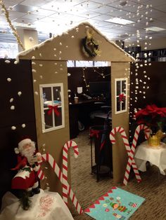 an office decorated for christmas with gingerbread houses and candy canes