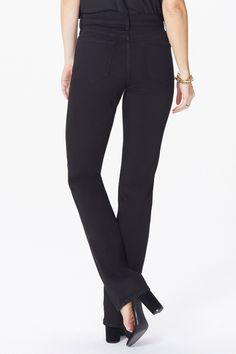 This classic fit can do no wrong. The easy, figure-elongating construction of NYDJ's Marilyn Straight Pants pairs well with everything, thanks to a flattering waist and a versatile, knee-to-hem, straight-leg fit. Our Lift Tuck® Technology uses a proprietary slimming panel with a patented criss-cross design to shape and support your curves for an always-sleek silhouette. Features classic five-pocket styling and a zip fly with button closure. | NYDJ Women's Marilyn Straight Pants In Petite in Black, Size: 0P Cross Designs, Straight Pants, Denim Fabric, Black Coat, Straight Jeans, Snug Fit, Black Fashion, Black Jeans, Comfort Fit