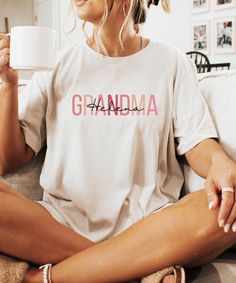 A pretty and comfy grandma shirt. A perfect holiday or birthday gift.- xoxo Nikki  PRODUCTION TIME: 1-3 days (Usually 2 days)  SHIPPING TIME: 2-5 days (Usually 3 days)  PRODUCT DESCRIPTION:        Bella Canvas Unisex T-Shirt        Super soft cotton and excellent quality print makes        100% Soft cotton (fiber content may vary for different colors)        Light fabric (4.2 oz/yd2  (142 g/m2))        Runs true size        Our Relaxed Fit Tee (Bella+ Canvas style 3001) is a unisex style that ru Comfy Fall Sweaters, Grandma Names, Best Grandma, Vintage Baby Clothes, Grandma Shirt, Bridesmaid Gift Boxes, Grandma Shirts, Comfy Shirts, Etsy Personalized Gifts